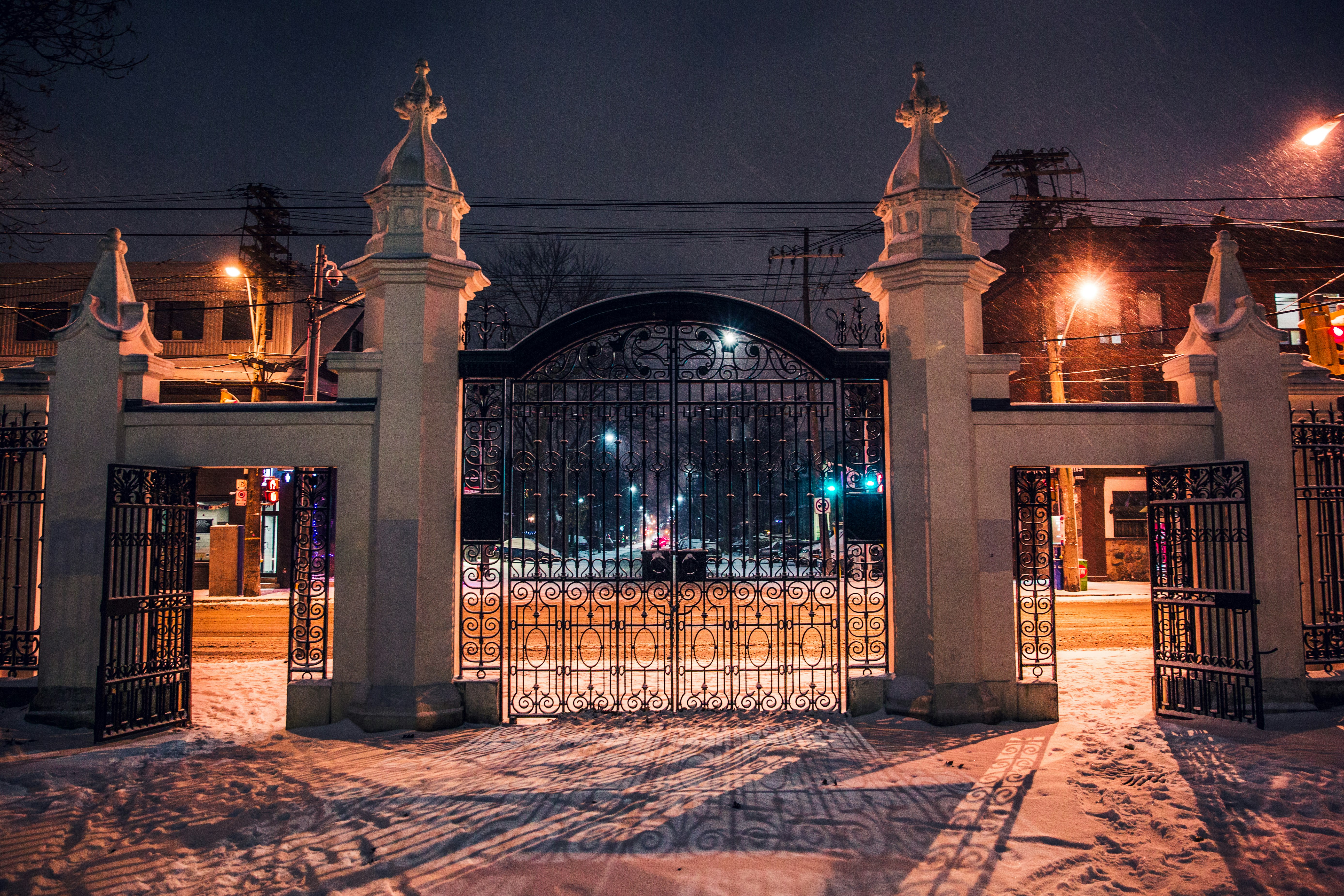 architectural photography of black metal and concrete gate